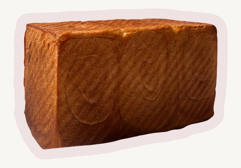 Shokupan, a square Japanese milk bread loaf with a golden crust
